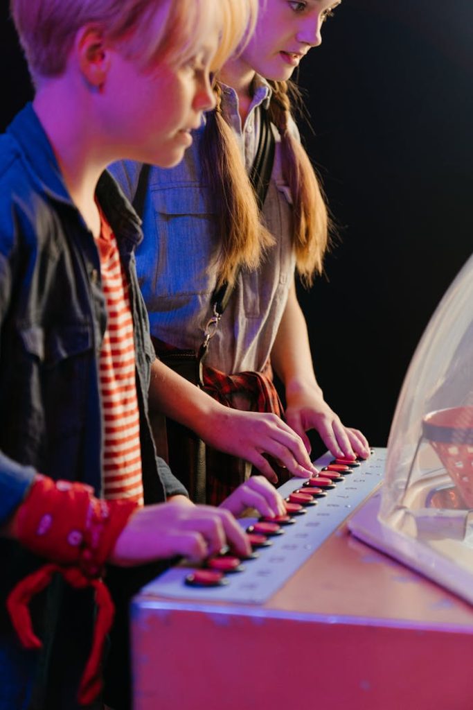 Two teenagers enjoy a retro arcade game, creating a nostalgic, playful atmosphere.